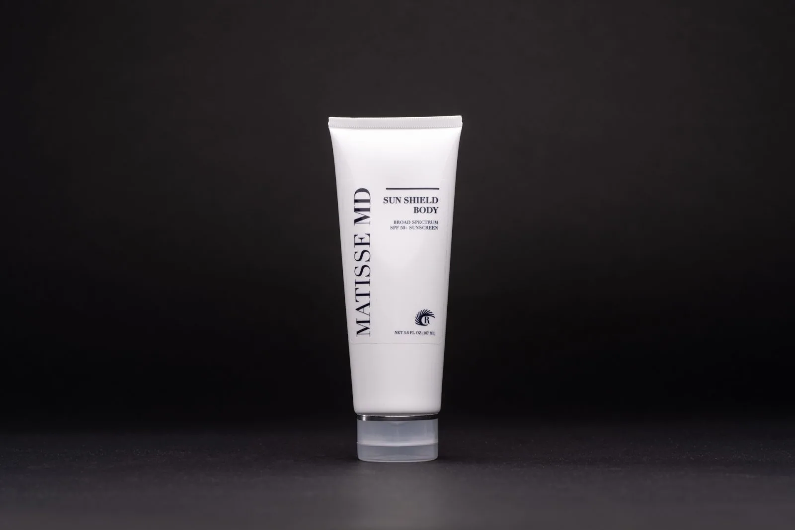 Matisse MD Sun Shield Body broad spectrum SPF 50 sunscreen tube against dark background